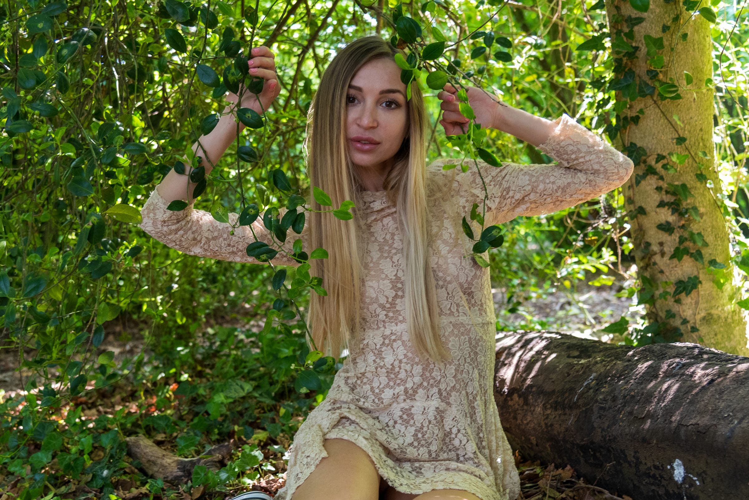 Lace dress among vines and leaves