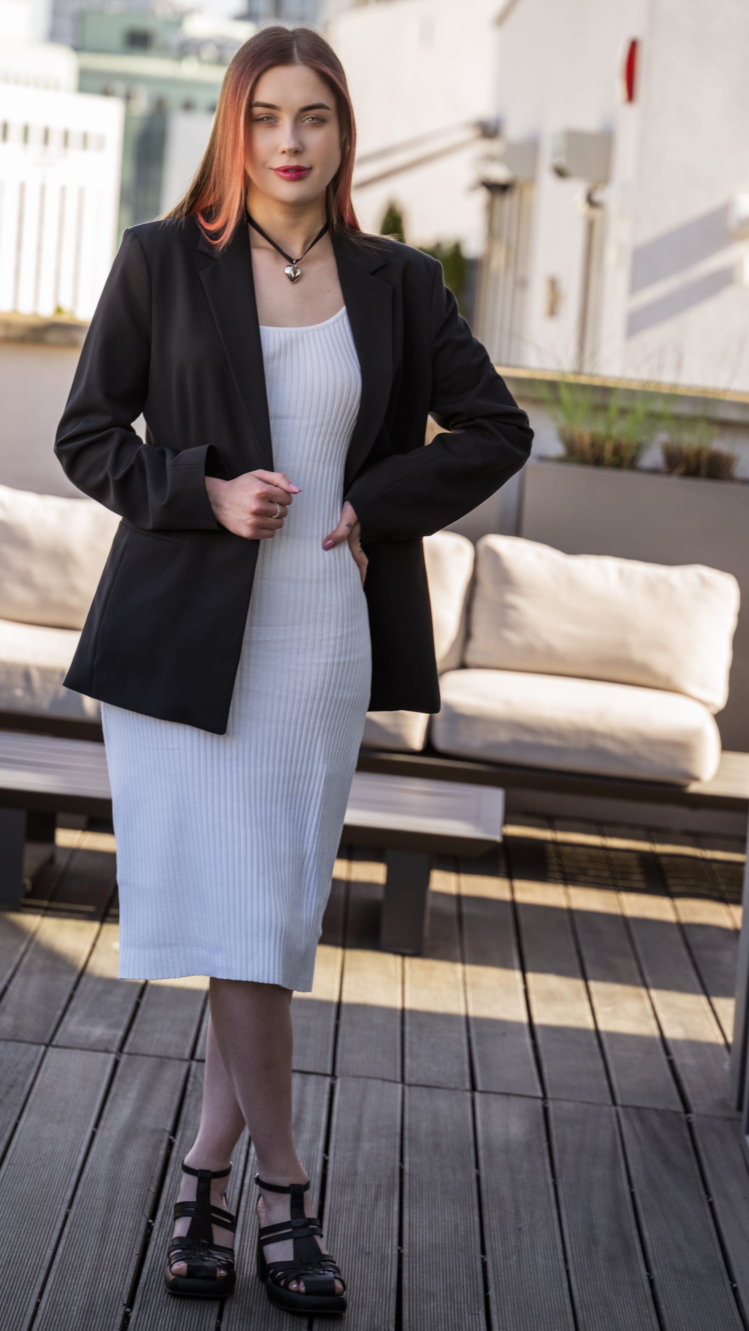 Rooftop portrait in blazer and dress