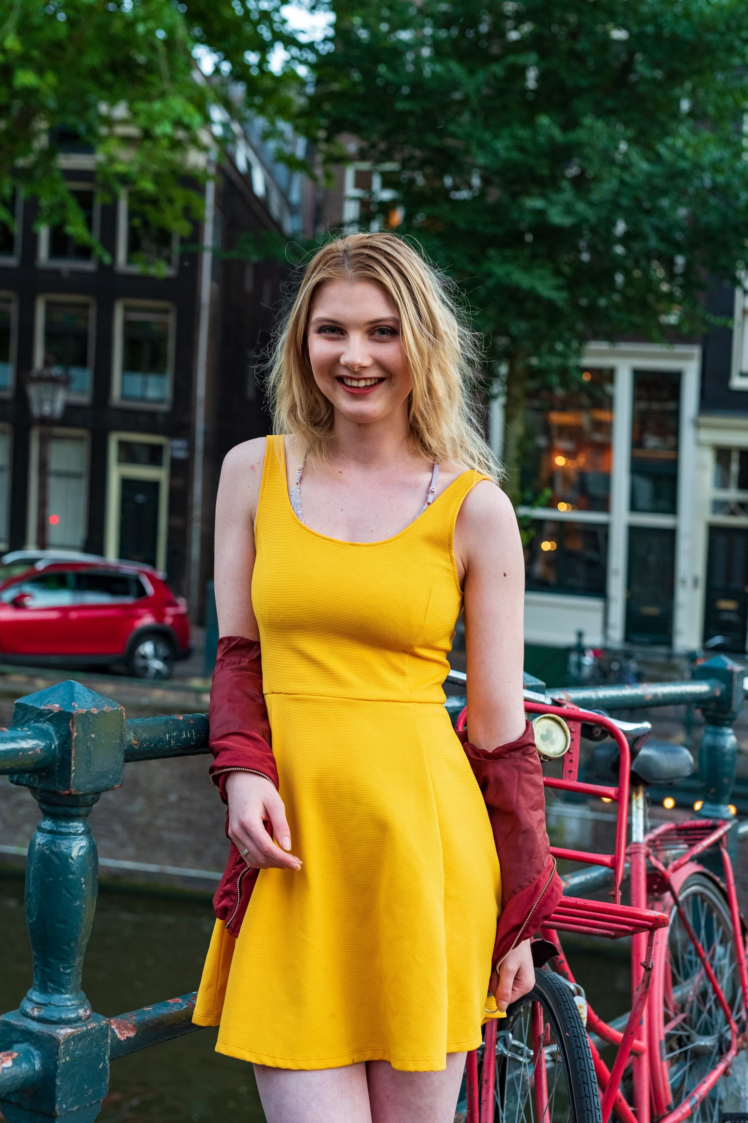 Yellow dress on a canal bridge