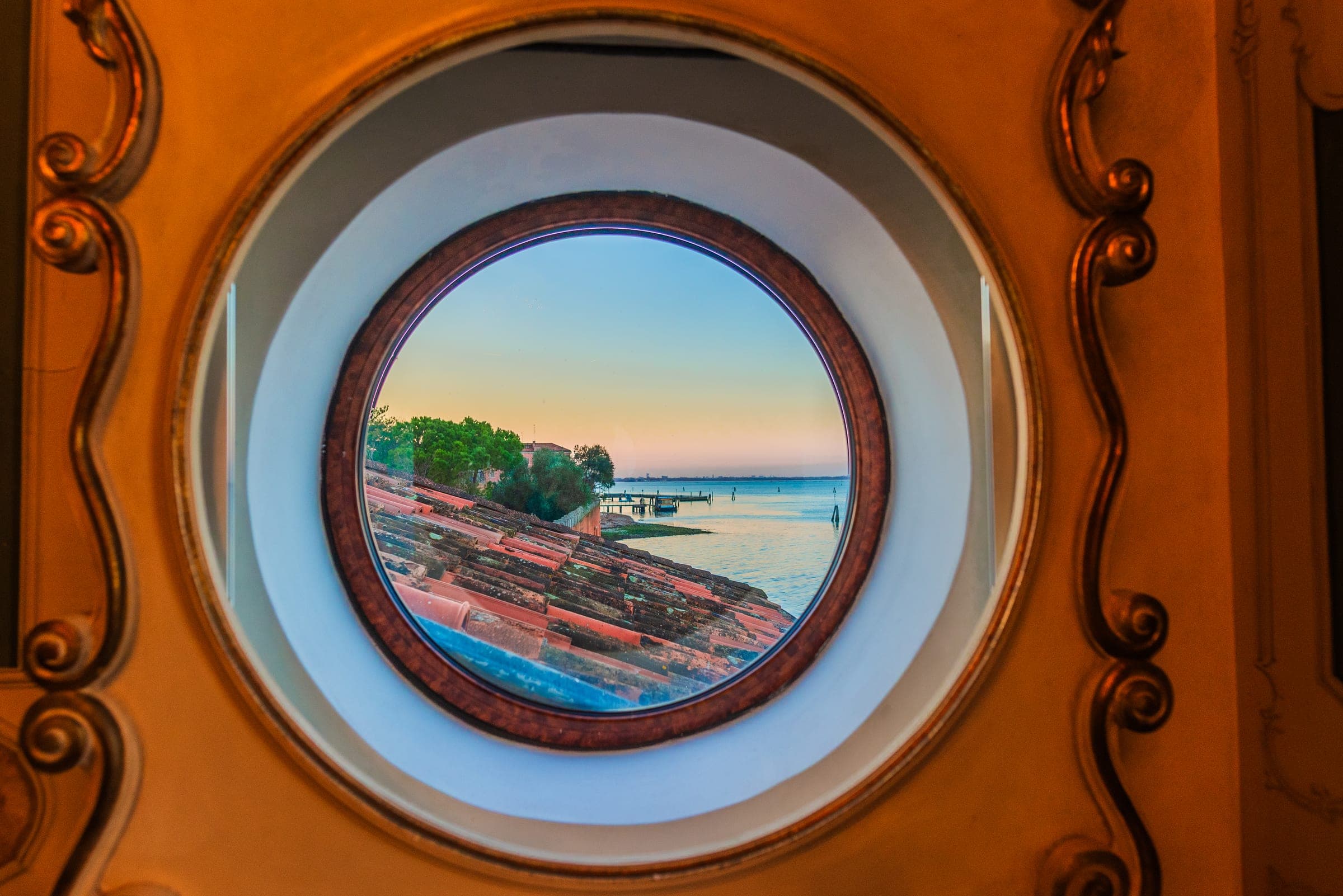 Lagoon view through ornate porthole