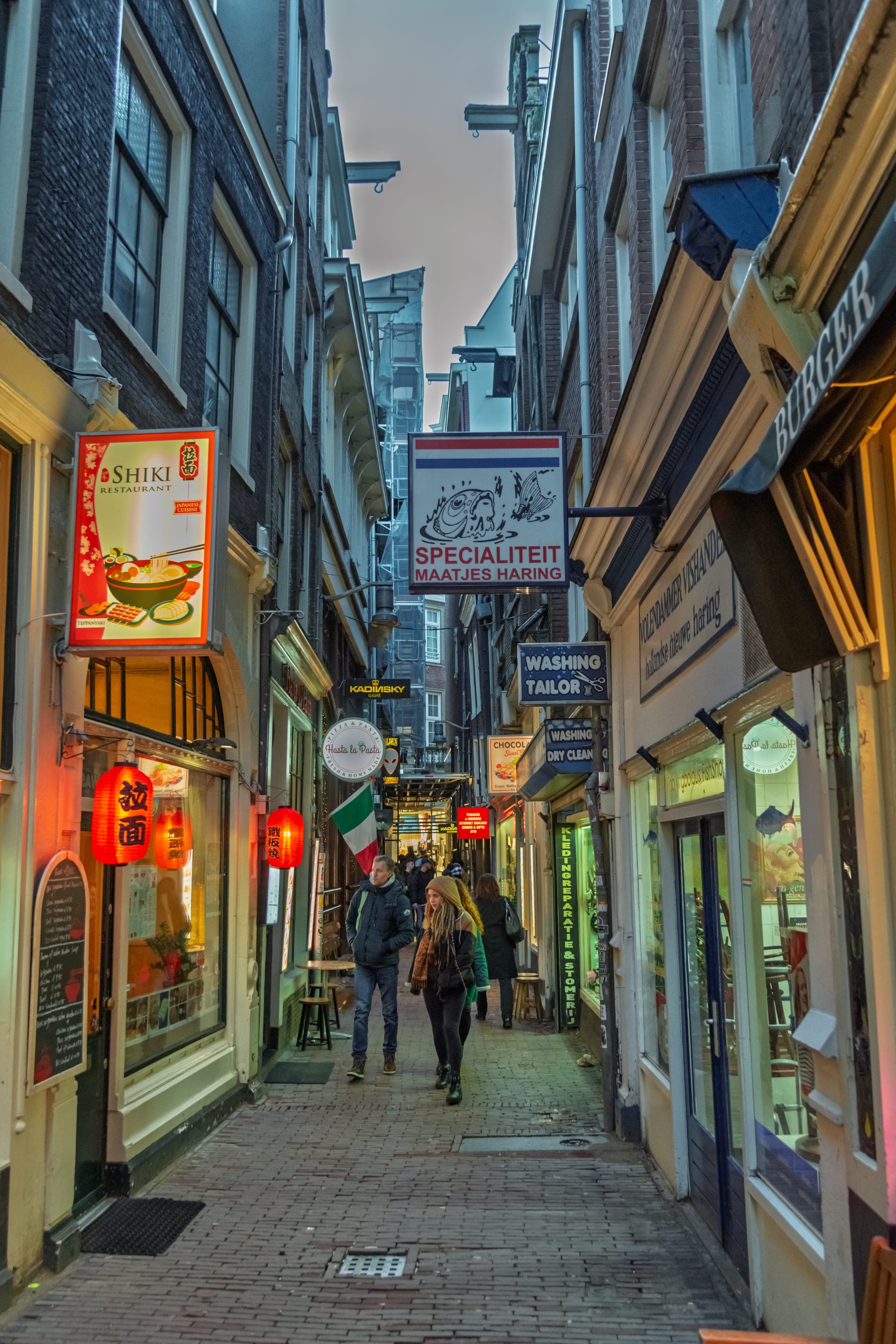 Narrow Centrum alley glowing at dusk
