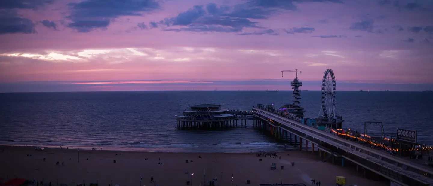The North Sea coast at Scheveningen — De Pier, the Kurhaus, and the wide beach under Dutch skies, from blazing sunsets to rare noctilucent nights.