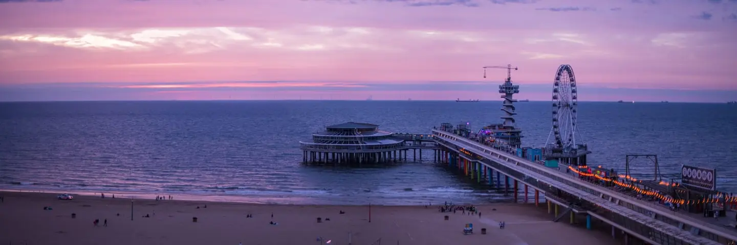 The North Sea coast at Scheveningen — De Pier, the Kurhaus, and the wide beach under Dutch skies, from blazing sunsets to rare noctilucent nights.
